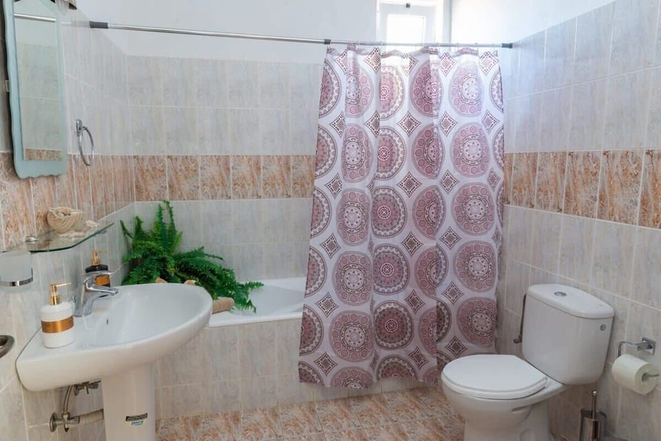 Indulge in tranquility with a bathroom featuring a soothing bathtub