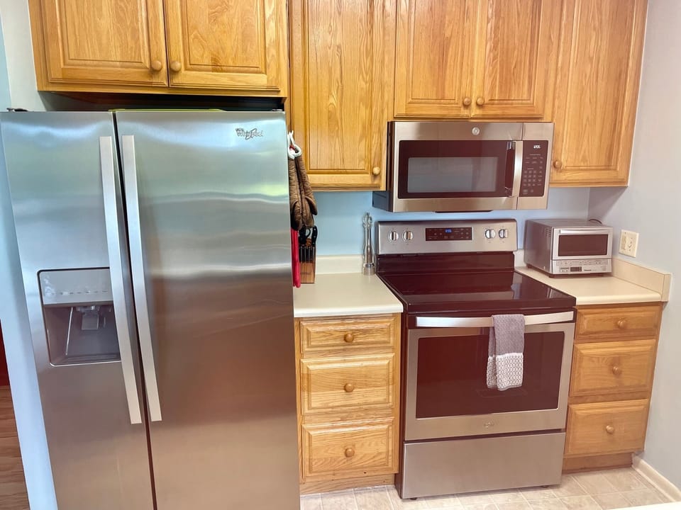 Kitchen with stainless appliances. 
