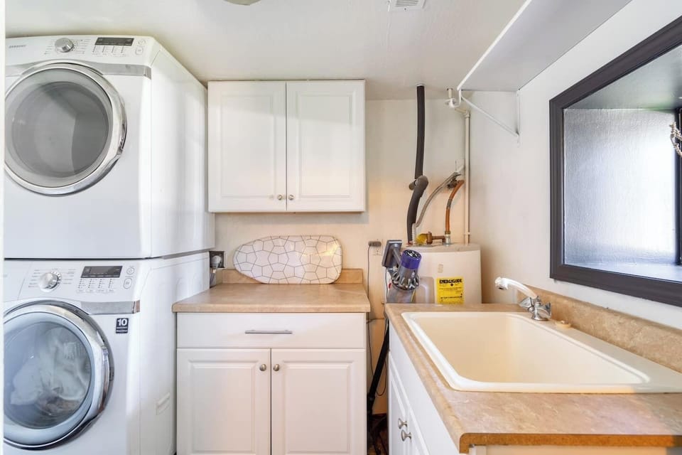In house washer and dryer, large utility sink. You'll find your dog bowls in the lower cabinets.