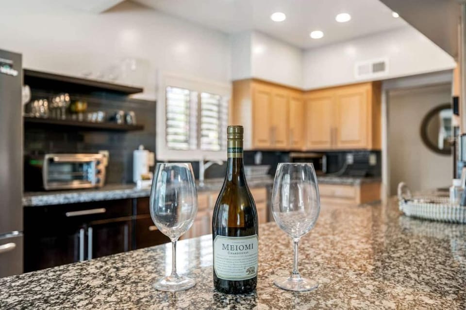 Open, updated kitchen is well stocked and ready for entertaining