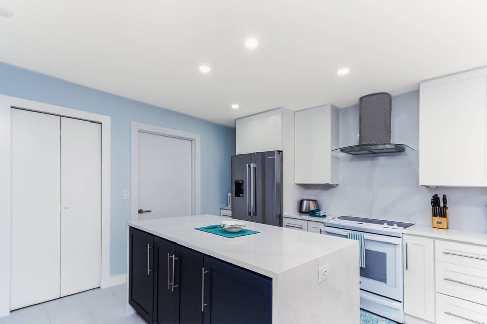Large high end renovated kitchen with Bosch appliances and new cabinetry stocked with dishes & cookware.