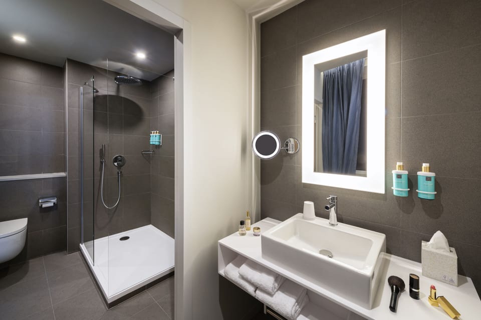 Shower, eco-friendly toiletries, hair dryer, towels