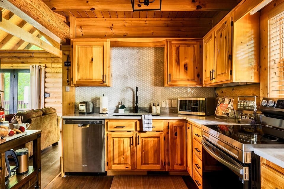 New renovated kitchen with granite countertops, marble backsplash, and stainless steel appliances. 