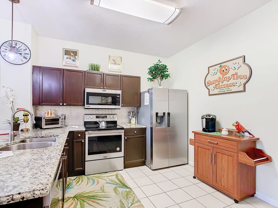 Well-equipped kitchen with stainless steel appliances and granite countertops.