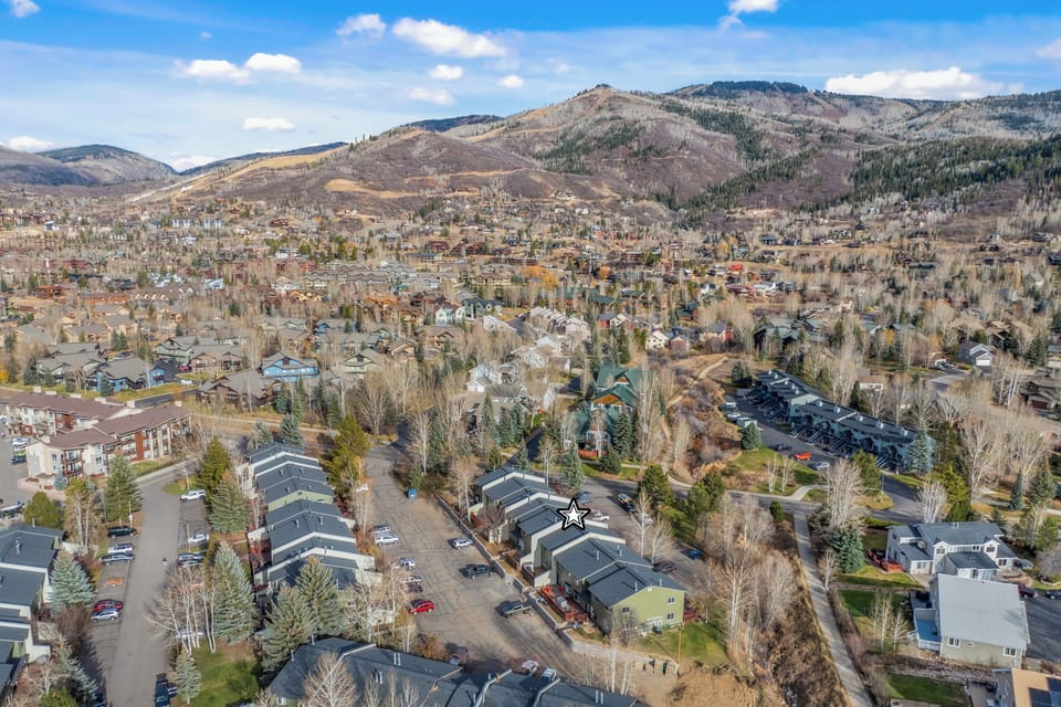Wake up to breathtaking mountain views that stretch endlessly beyond your window. You'll love how this peaceful neighborhood nestles perfectly into the valley below those majestic peaks.