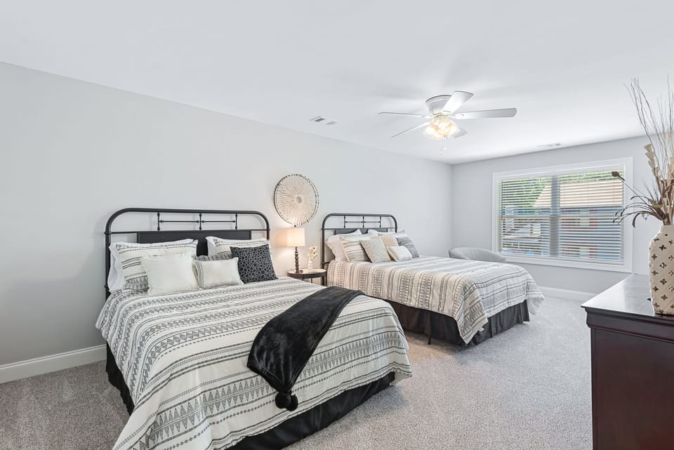 one of 2 oversized beds upstairs.  Sitting chairs have been added to this room.