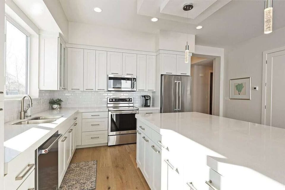 Prepare meals with ease using the provided coffee maker, double sink, and a selection of kitchen utensils, ensuring a seamless cooking experience during your stay.