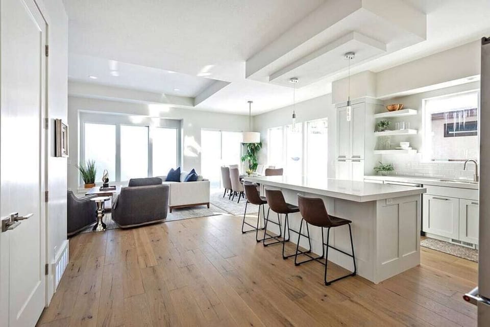 Experience seamless communication with friends and guests in the open-concept floor plan.
