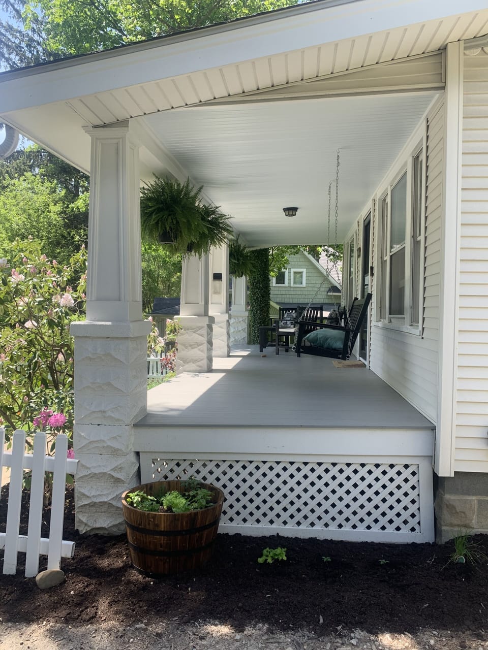 Front porch seating that has you overlooking the street  traffic. 