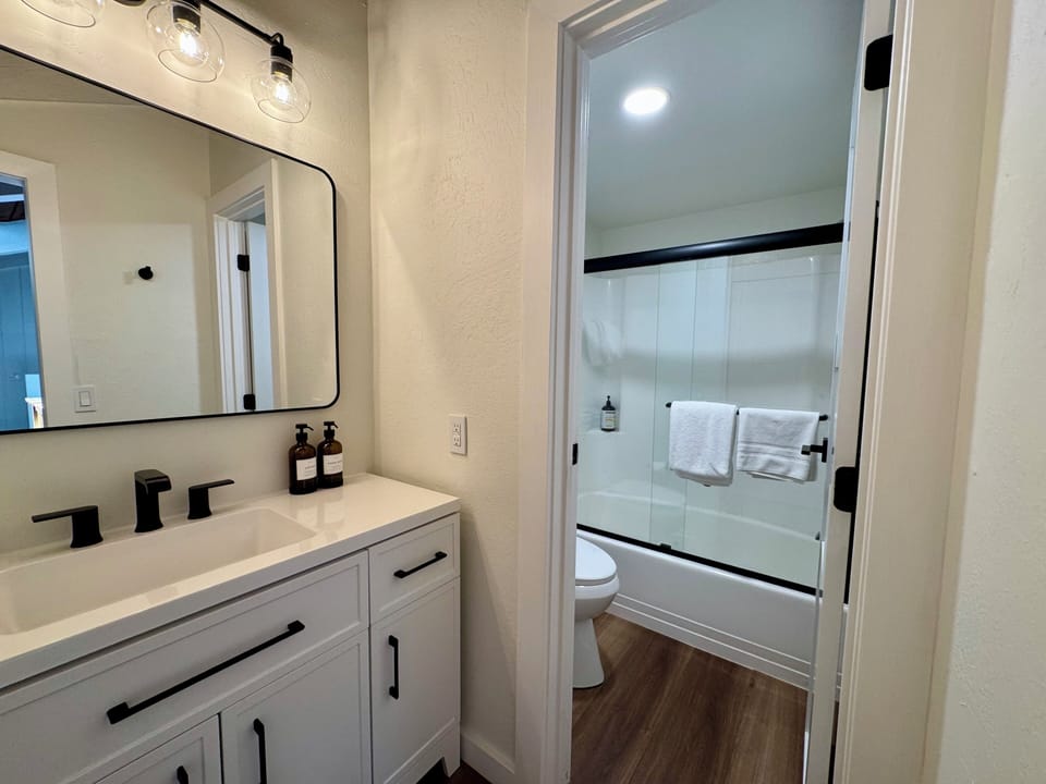 Loft bathroom - vanity has solid stone countertops.
