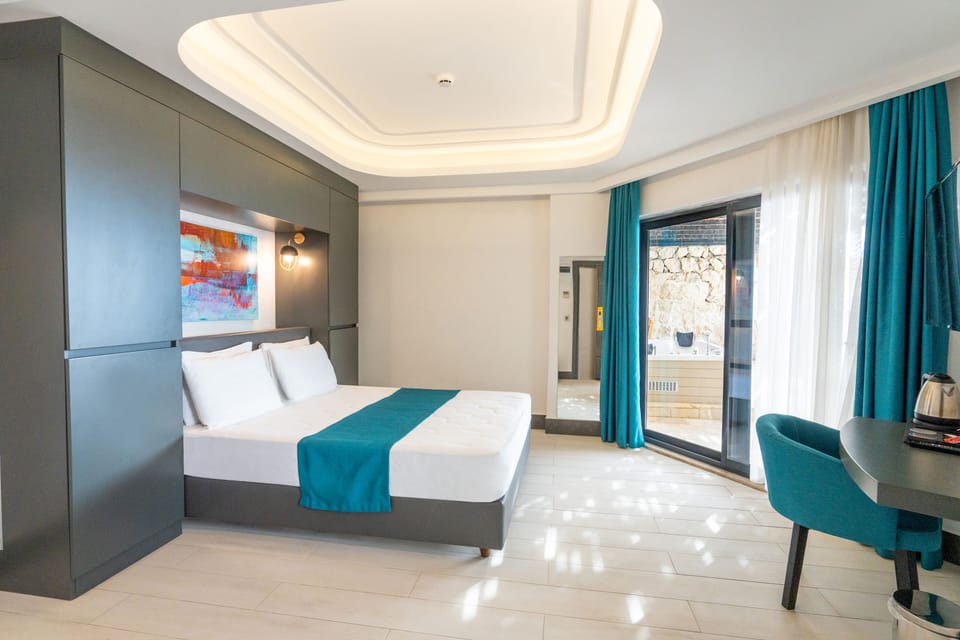 Family Room, Jetted Tub, Sea View | Minibar, in-room safe, desk, laptop workspace