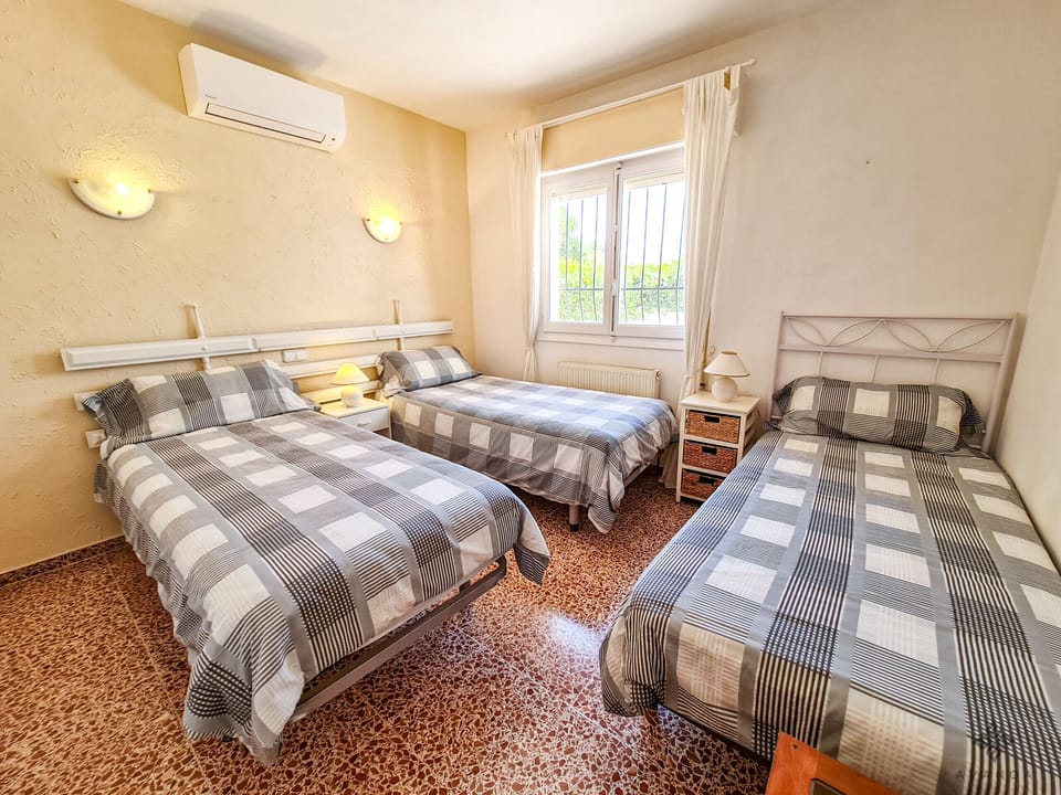 Bedroom with double bed and air conditioning