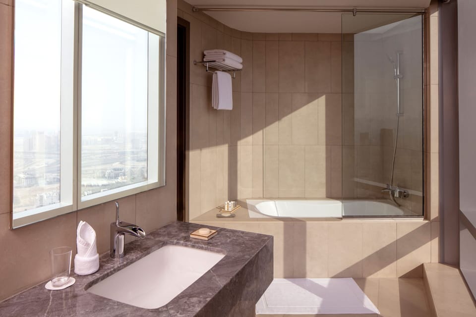 Combined shower/tub, eco-friendly toiletries, hair dryer, bathrobes