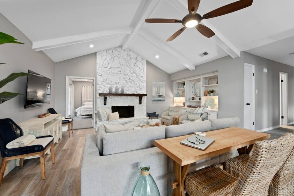 Large light and bright living room with 2 full seating areas