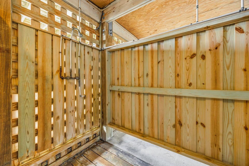 Your private outdoor shower features beautiful cedar walls and an open-air design for refreshing nature immersion.