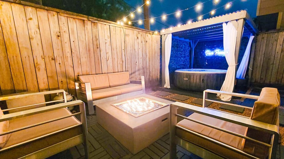 Enjoy yourselves on our backyard patio with a nice warm hot tub, string lights, a BBQ grill, and comfortable outdoor furniture to relax on!