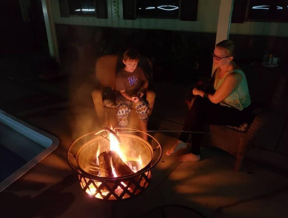 Camper has it's own firepit too.  Firewood provided no additional charge