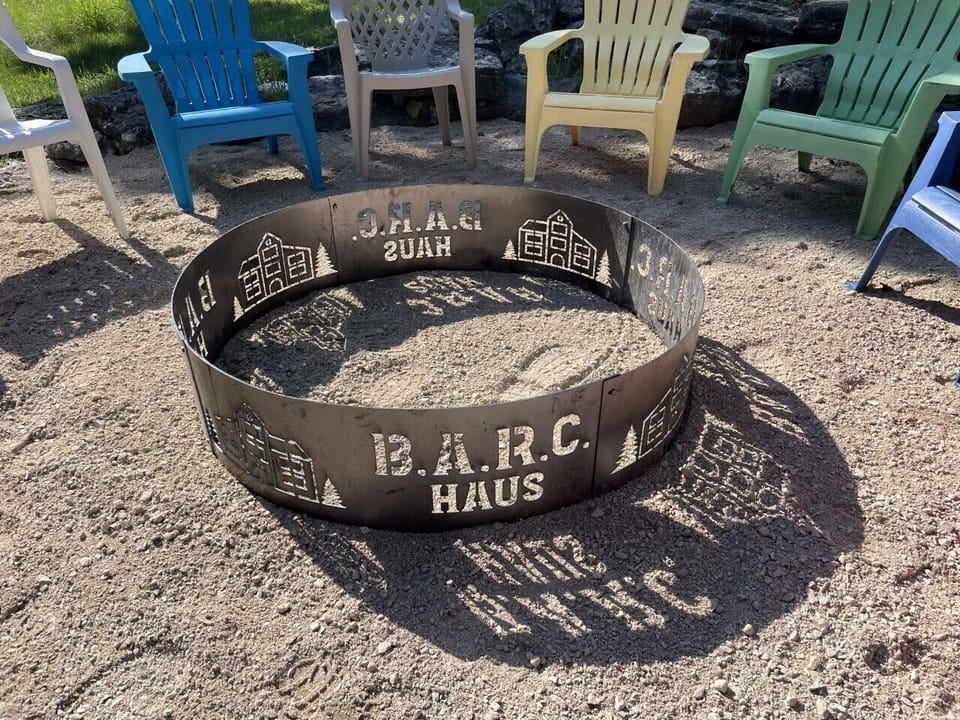 Custom firepit with ample seating and 3 acre yard