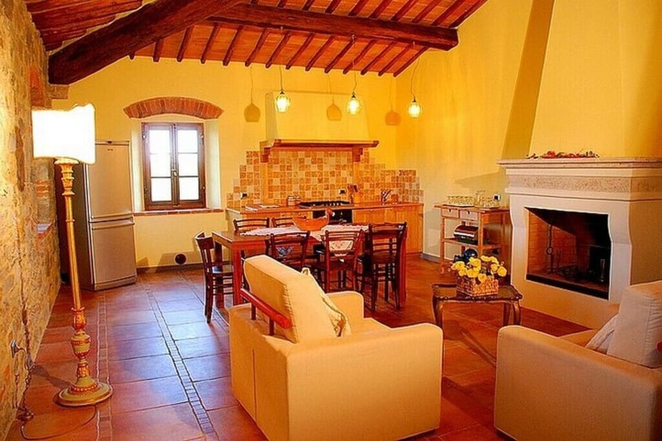 Sitting room with fireplace, Dining room and Kitchen