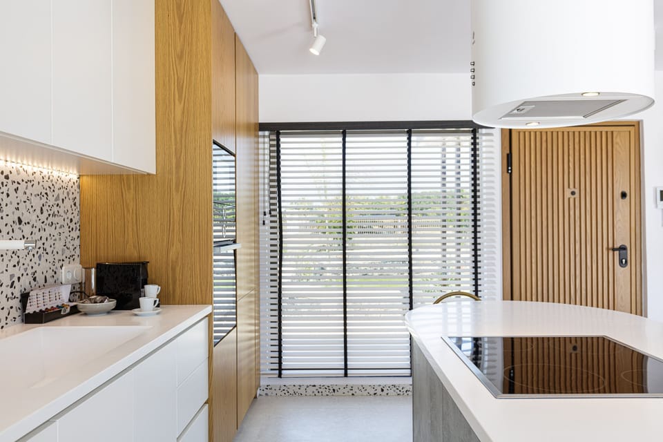 Kitchen has branded appliances and island to cook as a family