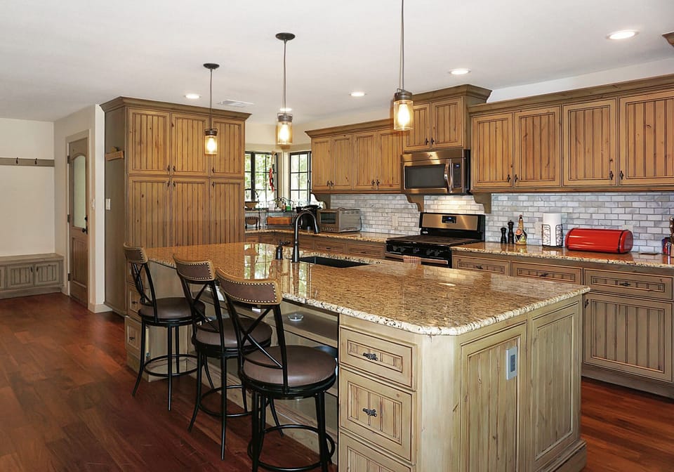 Full kitchen with large granite counter tops