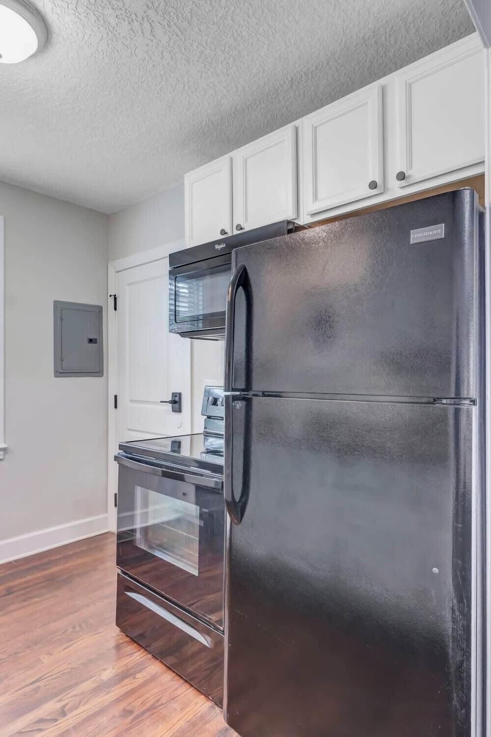 Newly renovated kitchen space with ample cooking utensils for a home-cooked meal.