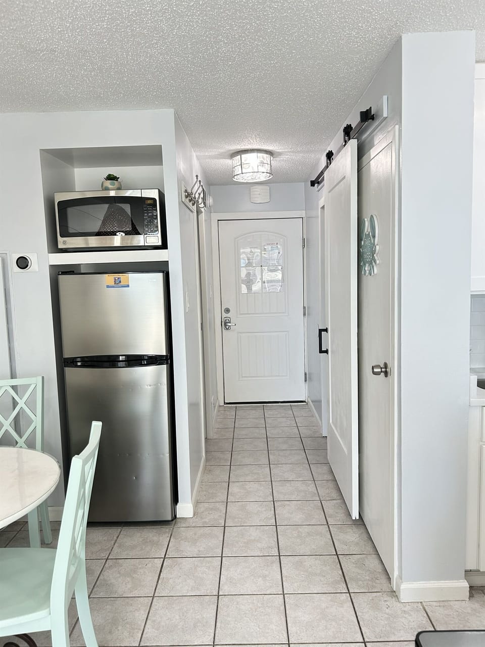 Bright, clean coastal studio entrance