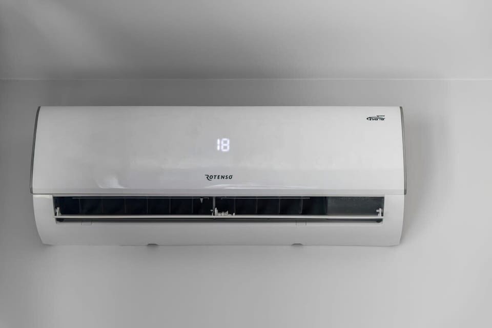 A mounted air conditioning unit, ensuring a comfortable temperature throughout the apartment.