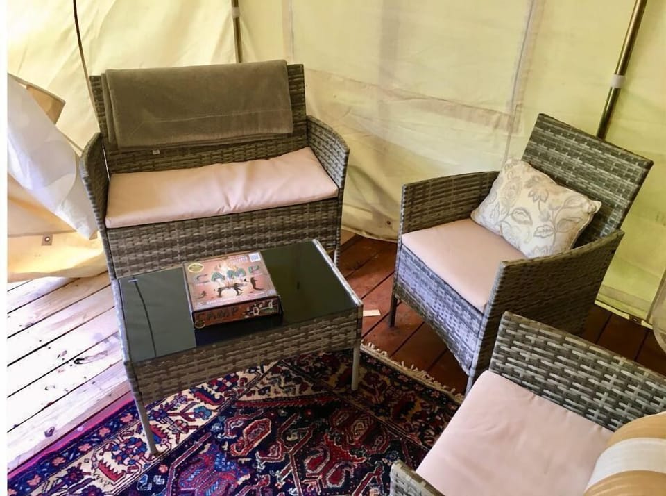 Sitting area w/ furnishings in every tent and breakfast rental. 