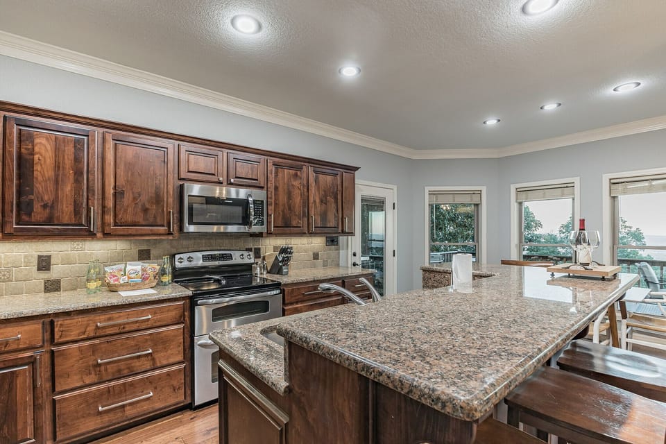 Full and well stocked kitchen with island. Everything you need to make it home