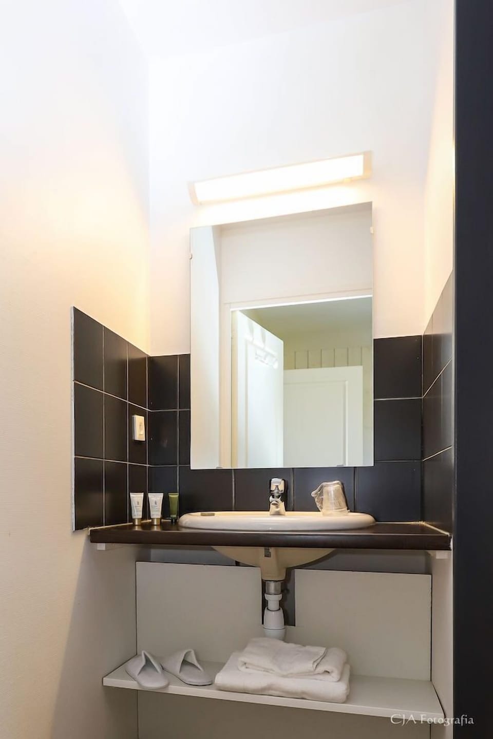 Get ready for your day in the bright bathroom.