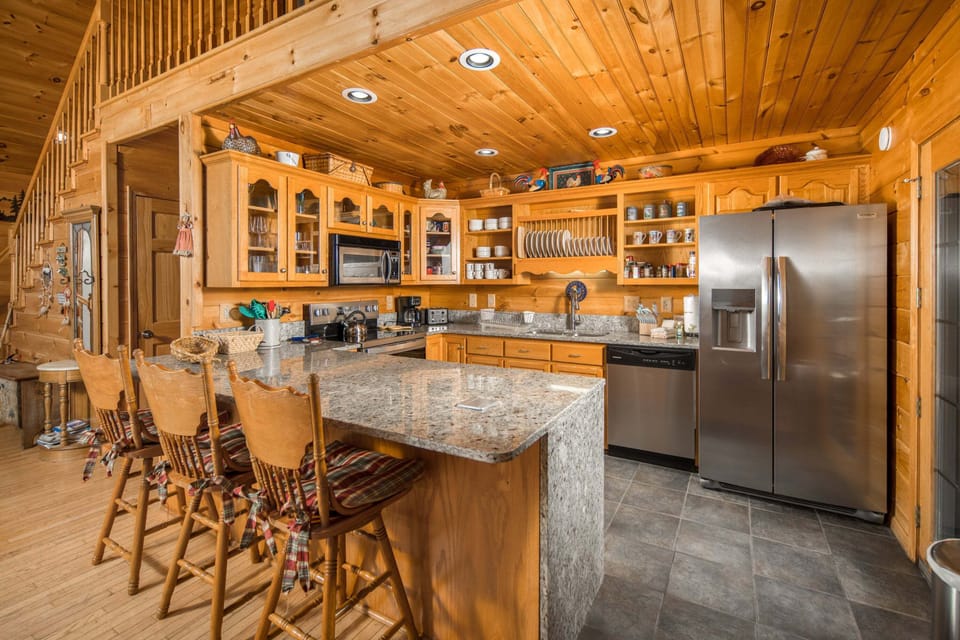 Spacious kitchen with granite countertops, stainless steel appliances, and plenty of room to cook together