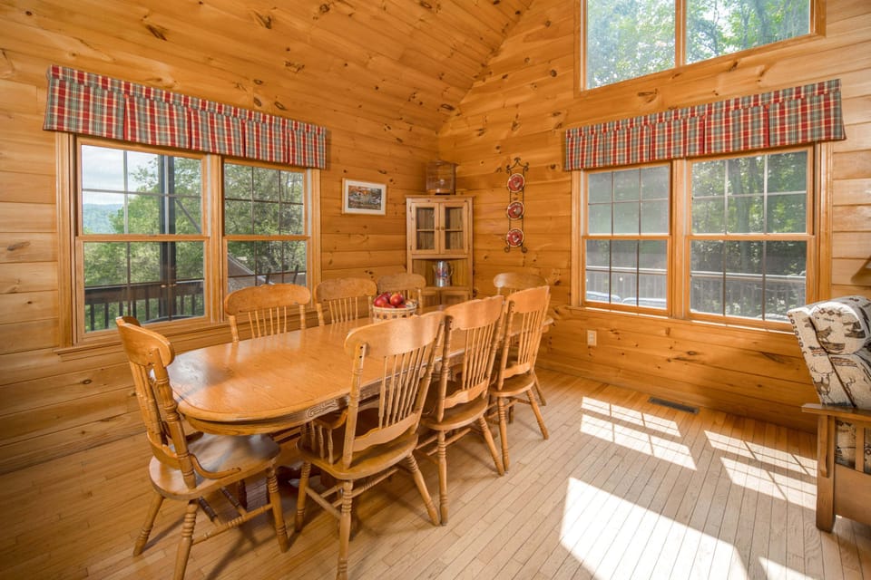 Gather around the dining table for meals with beautiful views through the surrounding windows