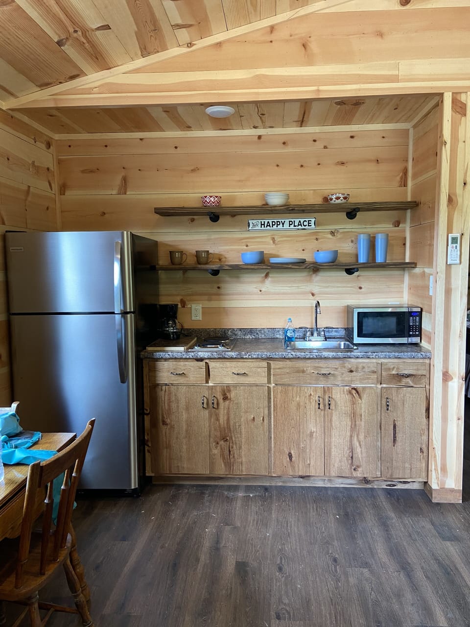 full size refrigerator, 4 burner stove top, toaster, coffee pot, microwave