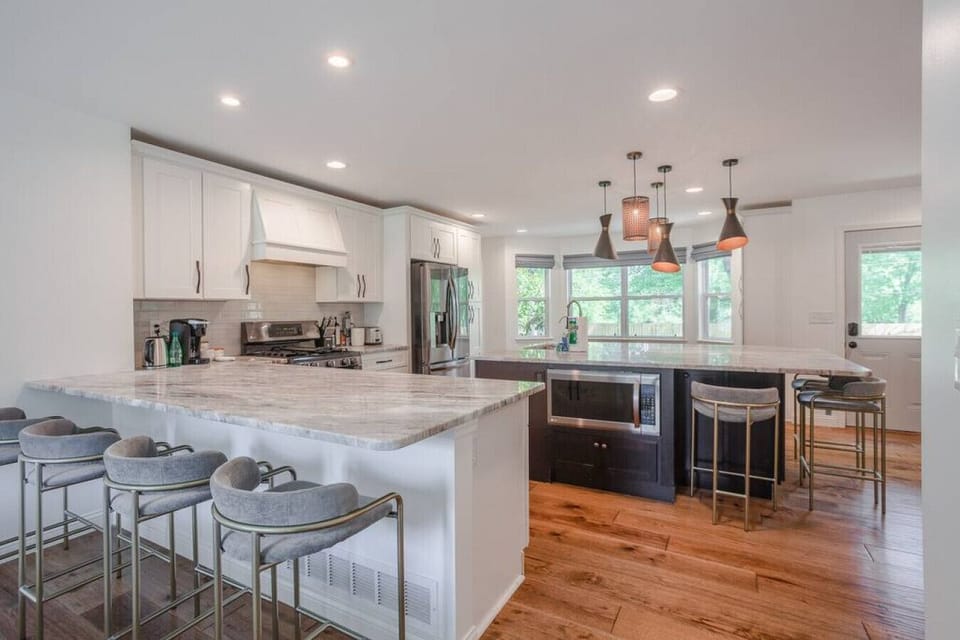 Kitchen area with bar seating and island seating for 9