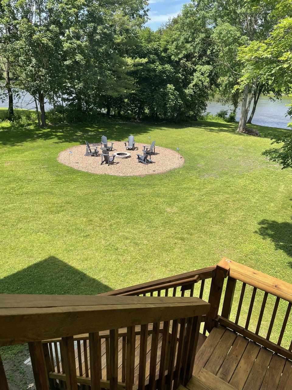 Stairs from your private deck leading to your riverfront property and firepit