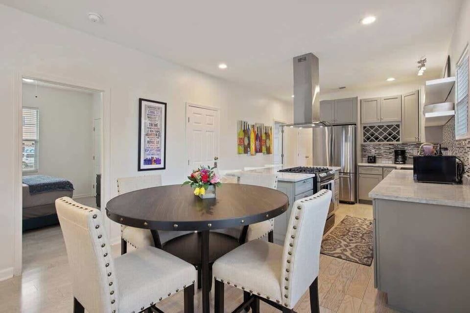 Stylish dining area next to the kitchen, offering a comfortable spot for group meals and conversation.