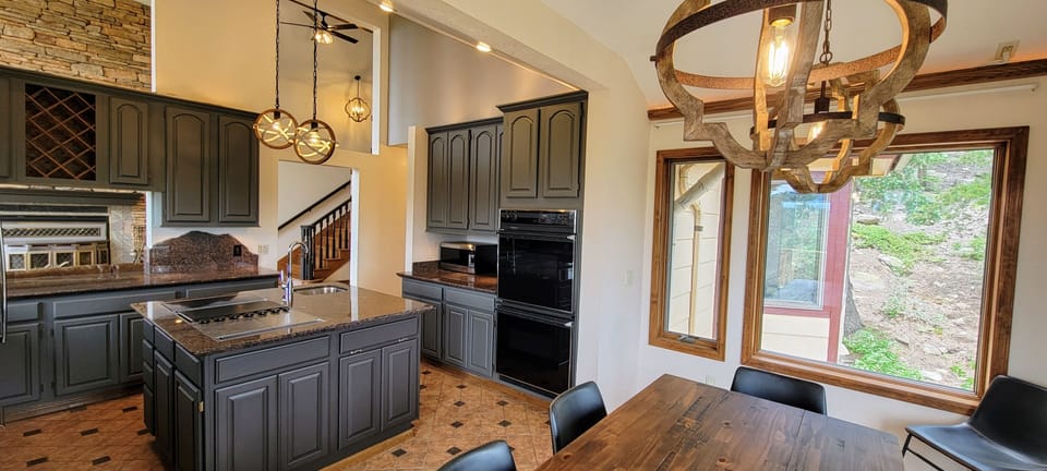 Kitchen opens to the main living room and office area.