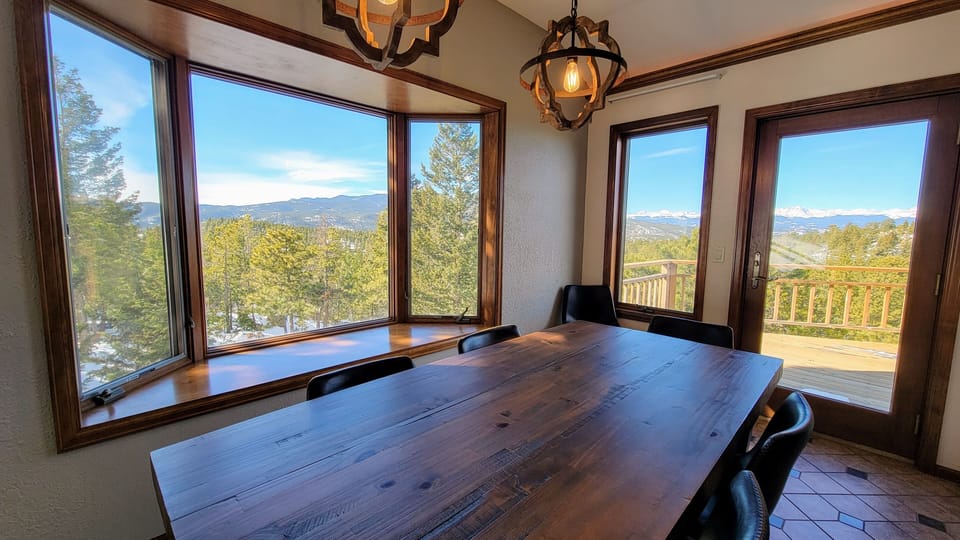 Large kitchen table for group meals with fantastic views.