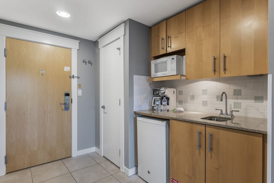 Kitchenette with plates, utensils etc.