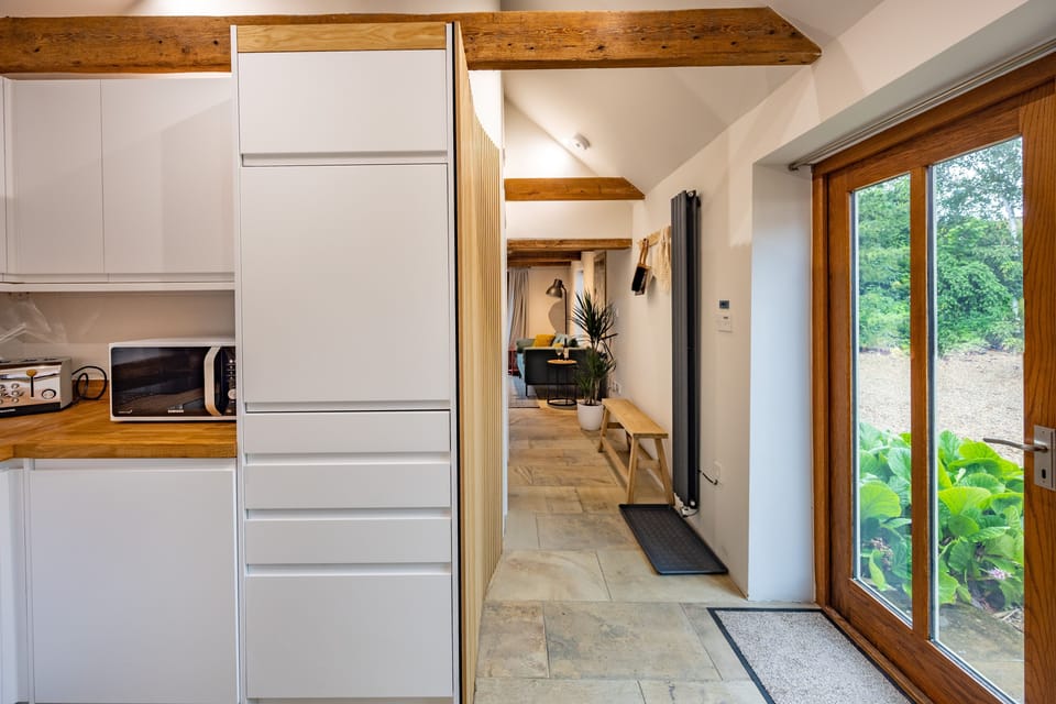 Ground floor: Kitchen area with patio doors