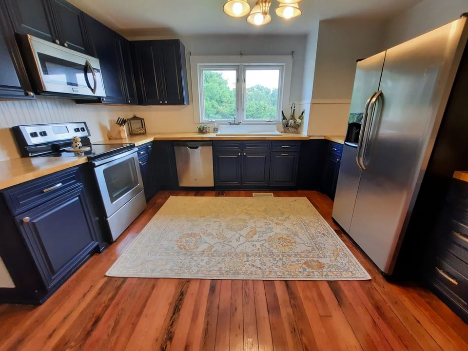 Renovated kitchen with restored antique sink that was found under the house