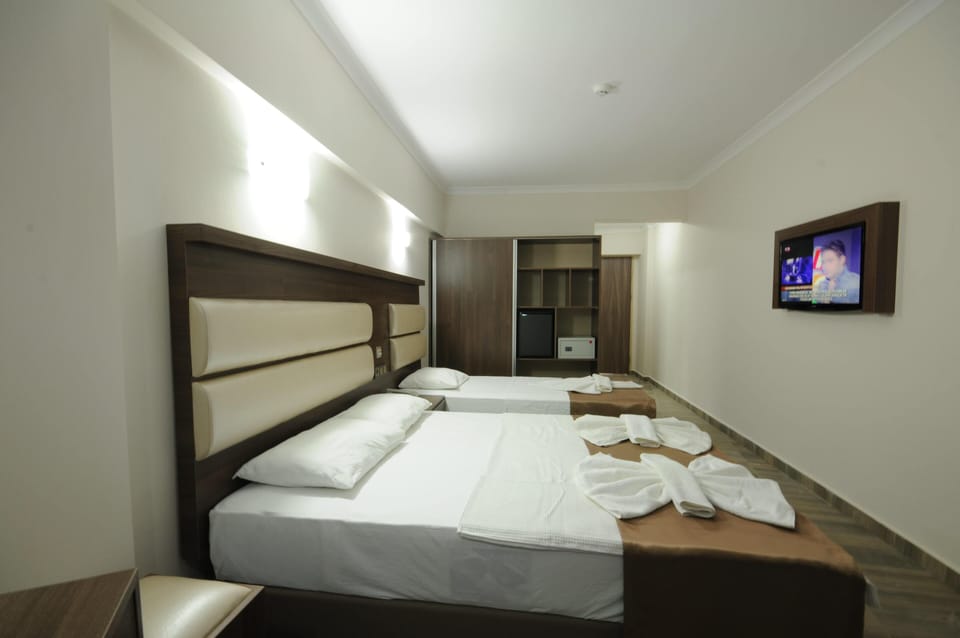 Standard Triple Room, Non Smoking | Minibar, laptop workspace, free WiFi, bed sheets
