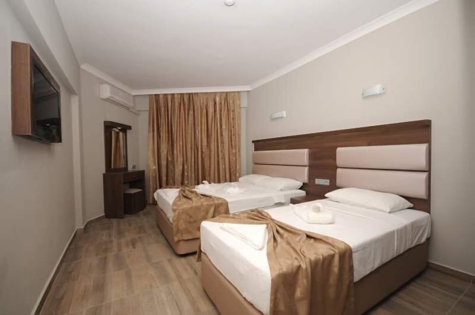 Standard Triple Room, Non Smoking | Minibar, laptop workspace, free WiFi, bed sheets