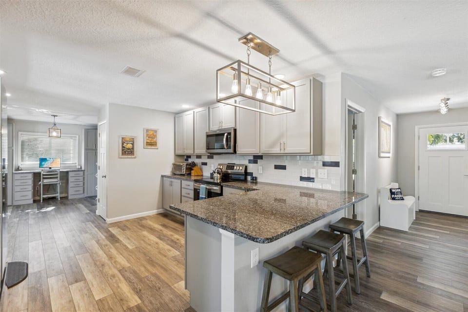 Large kitchen with lots of counter space, open design