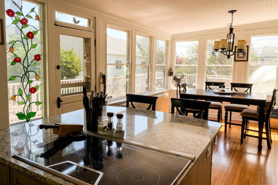 The kitchen island seats 2 and the kitchen table seats another 6.