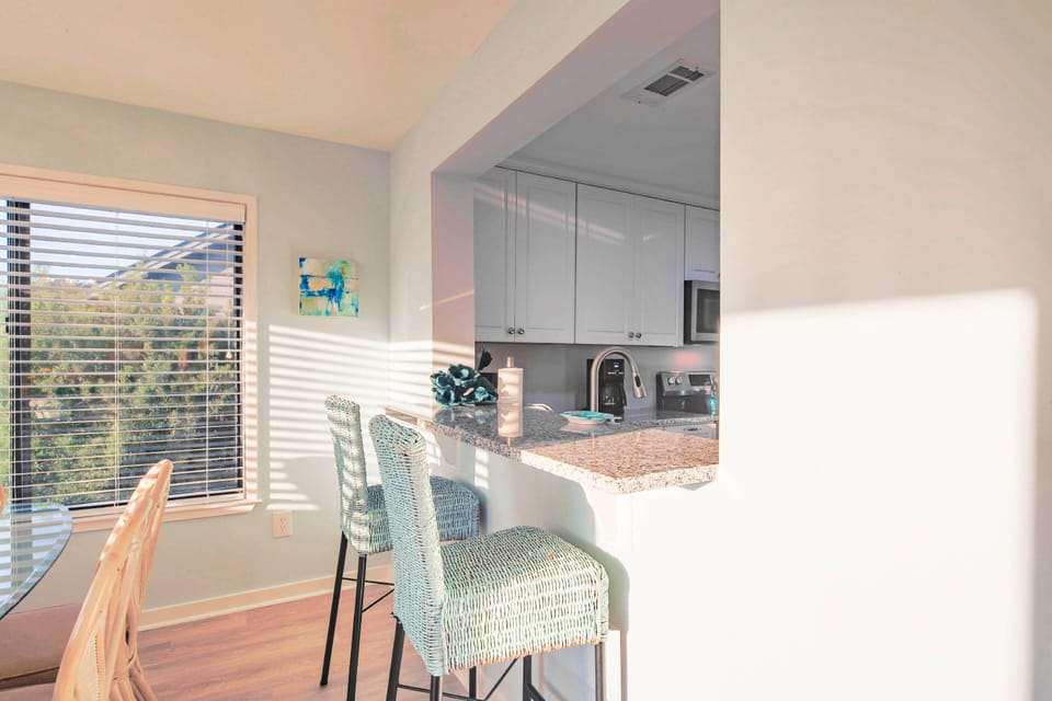The kitchen counter separates the dining area from the kitchen.