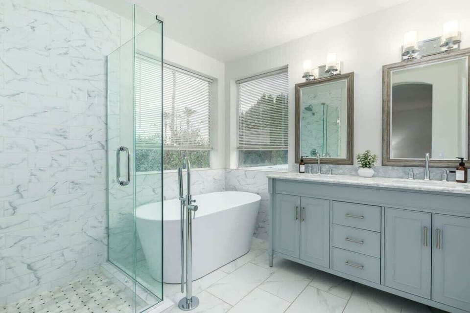Primary En-Suite Bathroom with Glass Shower and Soaking Tub