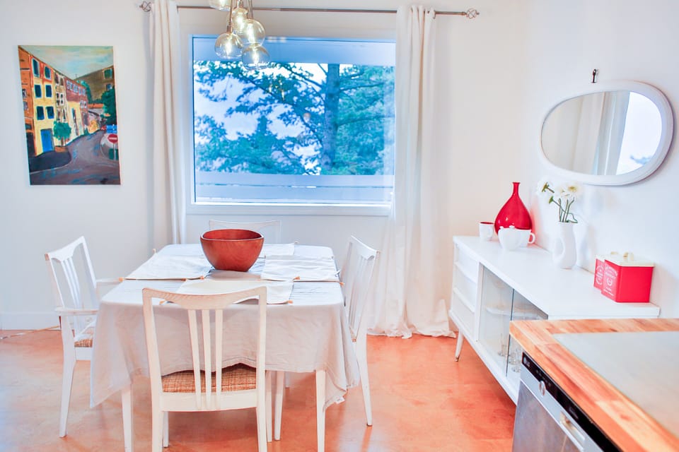 Modern whitewash wood and cork work throughout to create a warm cozy feel.