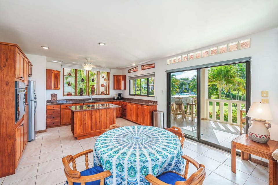 Kitchen features local Guanacaste wood in the cabinetry. 